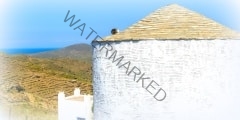 White greek windmills  at traditional village on Mykonos Island, Greece, Europe.