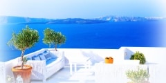 White balcony overlooking famous Santorini volcanic caldera, Oia