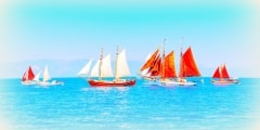 several old wooden sailing boats in Spetses island in Greece