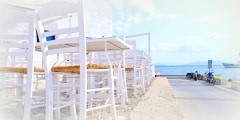 Tables and chairs of a tavern in Spetses island, Greece