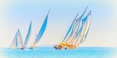 several classic wooden sailing boats in Spetses island in Greece
