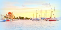 View of Ekklisia Isodia Theotokou church and sail boats  in the