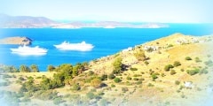 Two cruise ships moving into the port city of Skala in Patmos, G