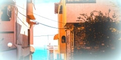 some houses next to each other with a city in the background