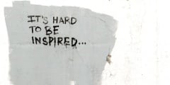 Color DSLR image of grungy black written graffiti on a grey conc