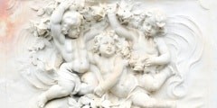 Black and white photography of basrelief with cherubs
