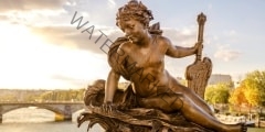 Statue of a nymph on the Pont Alexandre III in Paris