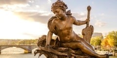 Statue of a nymph on the Pont Alexandre III in Paris
