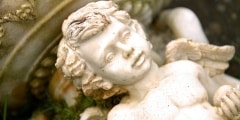 White statue of a boy