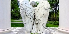 Majestic angel with wings on unknown tomb - landscape color phot