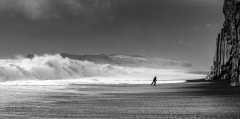 Man running from giant waves at Vik black beach - breathtaking I