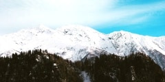 Snowy Mountains and blue sky with clouds Winter Landscape Travel