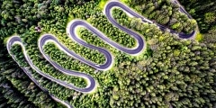 Drone view of a curvy road in Romania