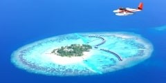Sea plane flying above Maldives islands